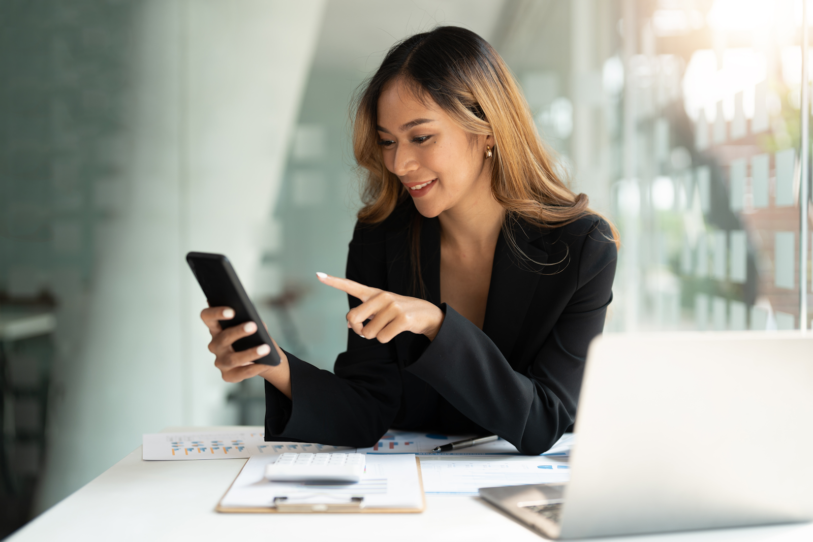 business woman looking at her mobile phone