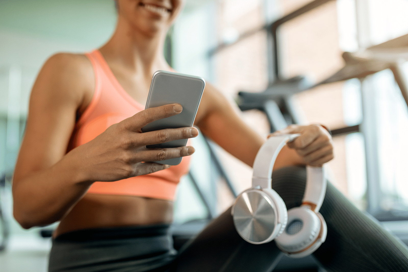 woman receiving a text message in a gym