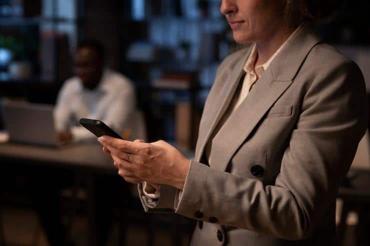 business woman texting on a phone