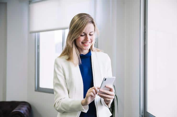woman sending a text message